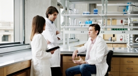 Techs discussing in lab